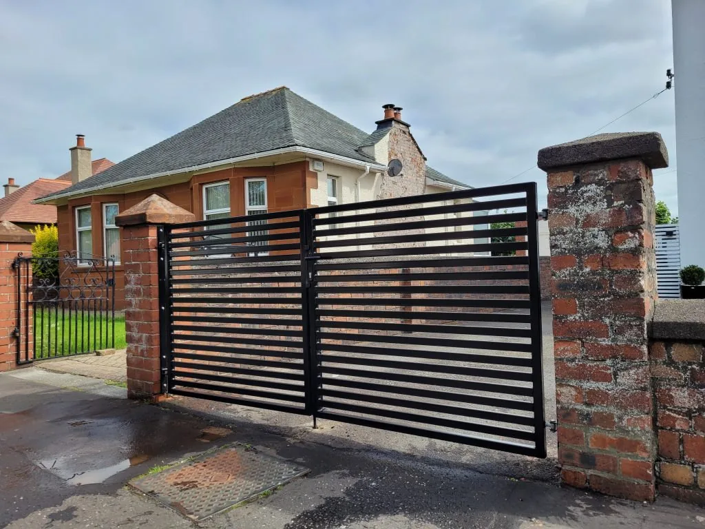 Wood driveway gate on steel framing
